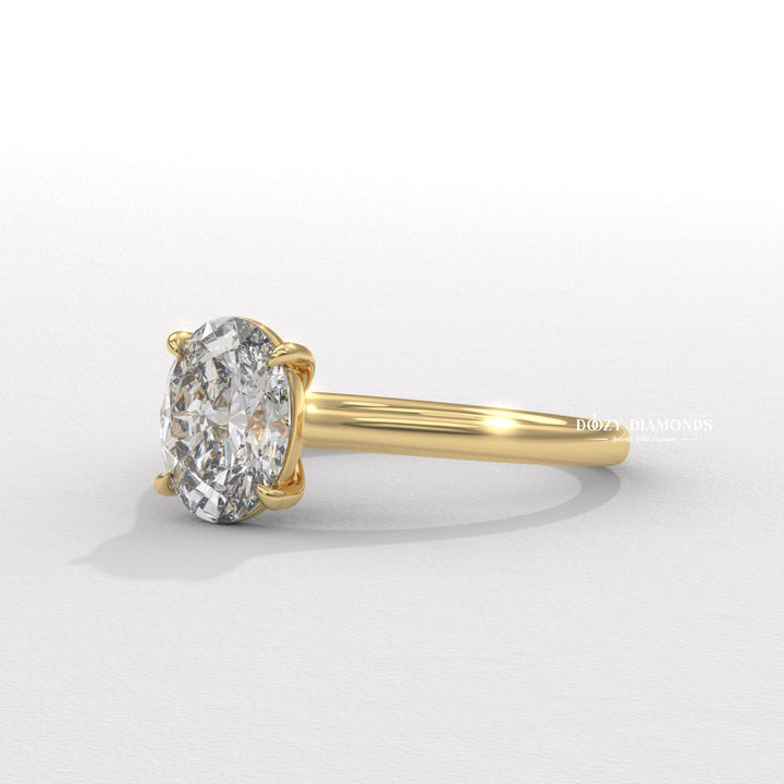 Oval solitaire engagement ring shown on hand for true-to-life sizing