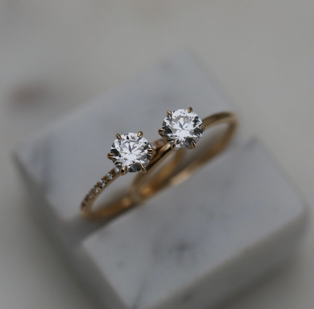 Round solitaire engagement ring close-up highlighting diamond sparkle