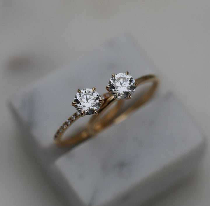 Round solitaire engagement ring close-up highlighting diamond sparkle