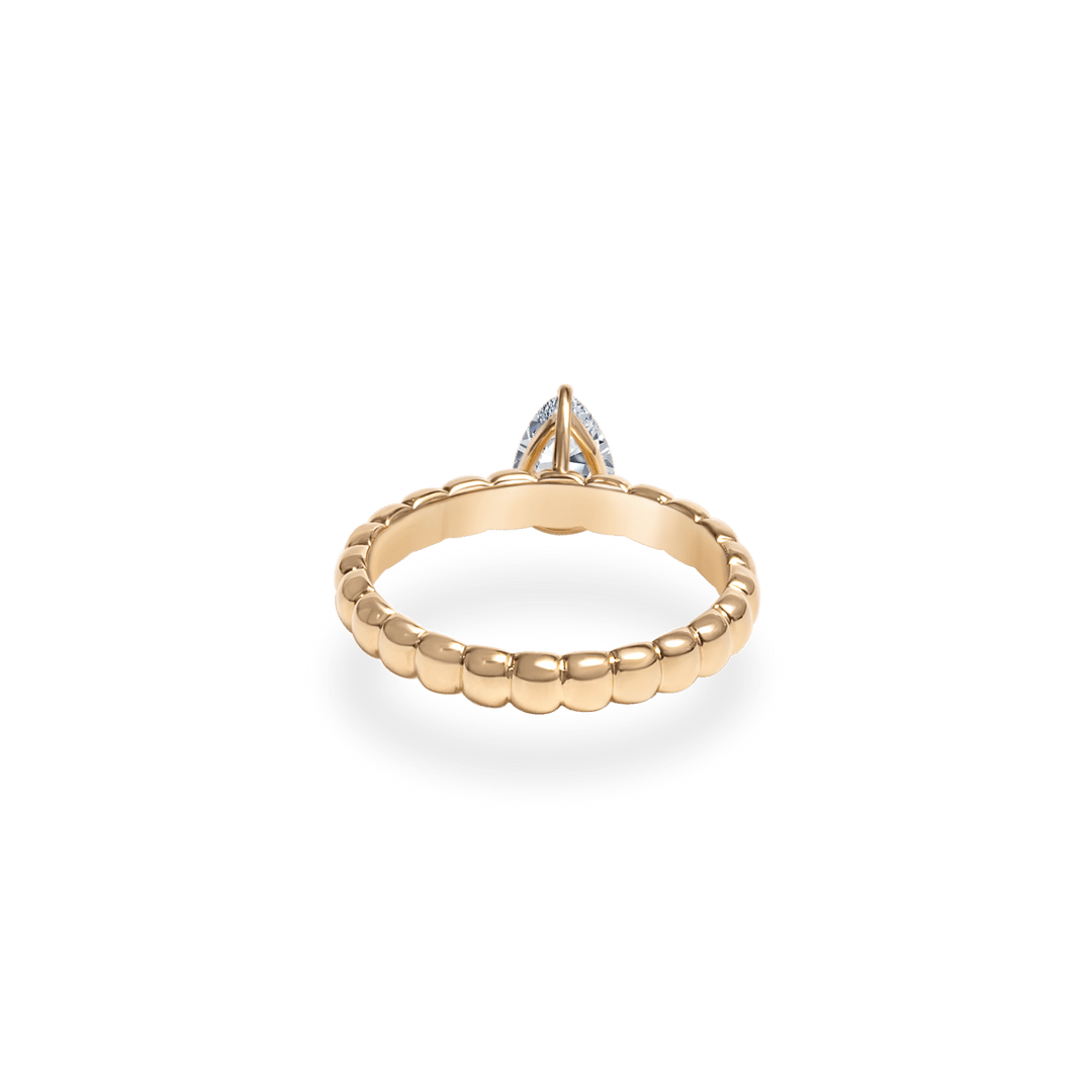 Side angle of pear solitaire diamond engagement ring