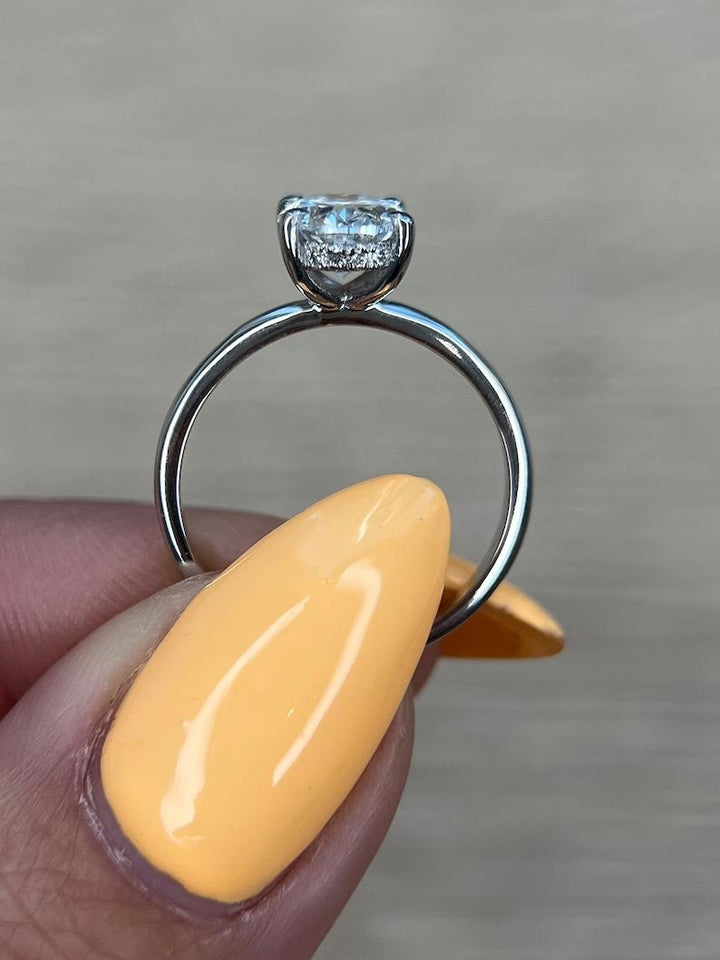 Oval hidden halo engagement ring with IGI certificate and packaging