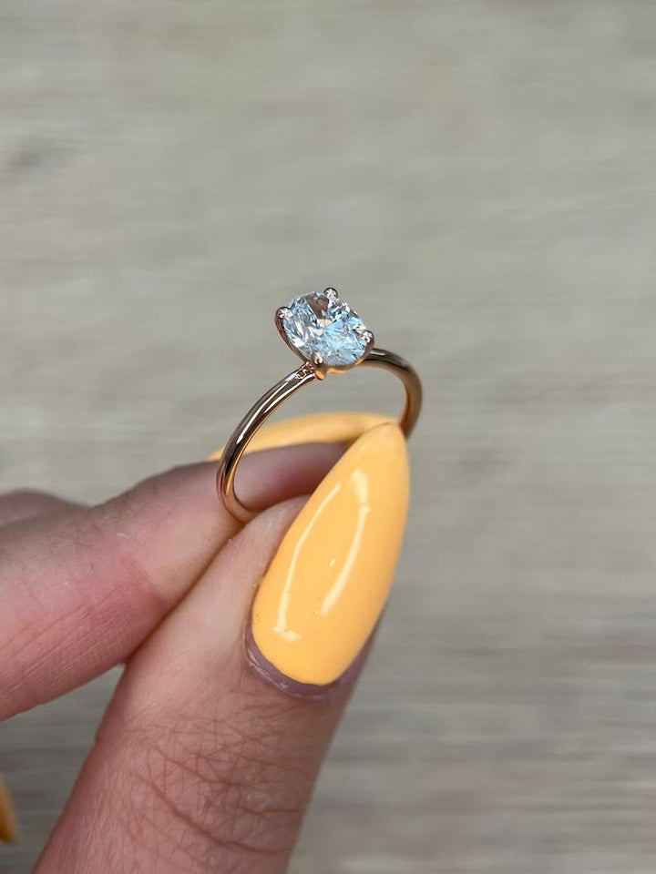 Side angle of oval solitaire diamond engagement ring