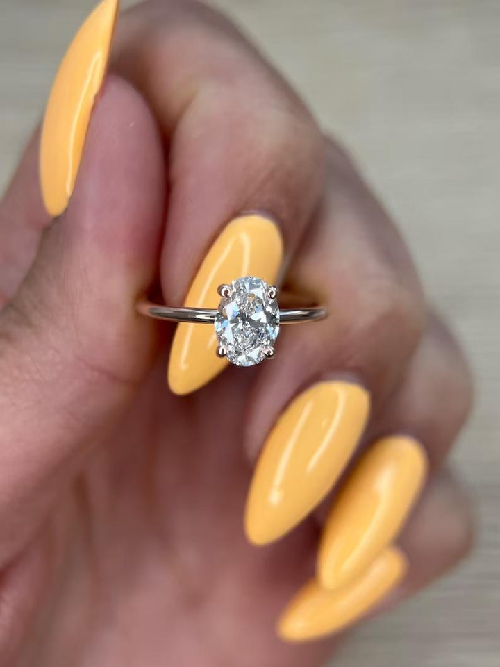 Oval solitaire lab grown diamond ring side profile in gold setting