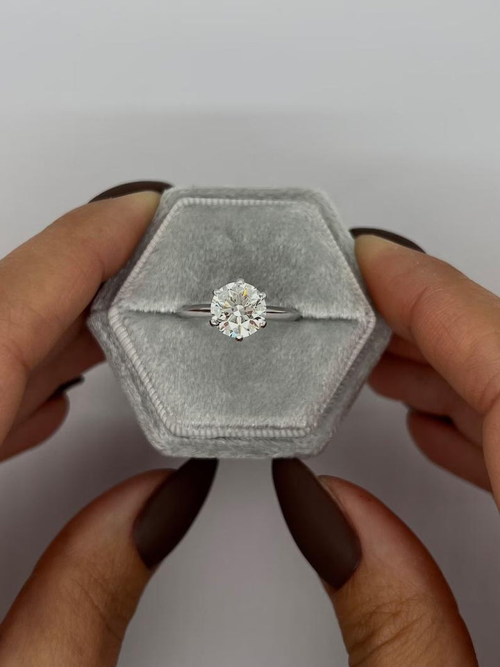 Round solitaire engagement ring with brilliant diamond sparkle