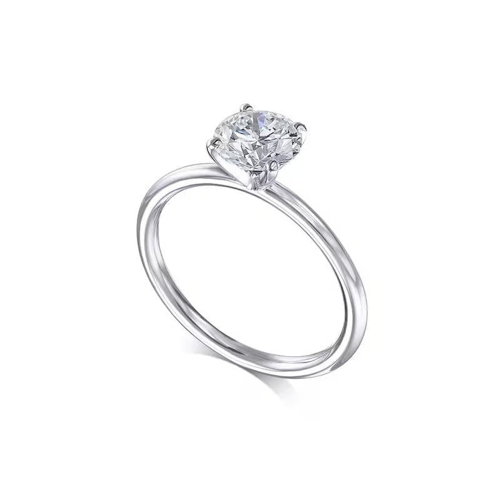 Round solitaire engagement ring photographed in natural light
