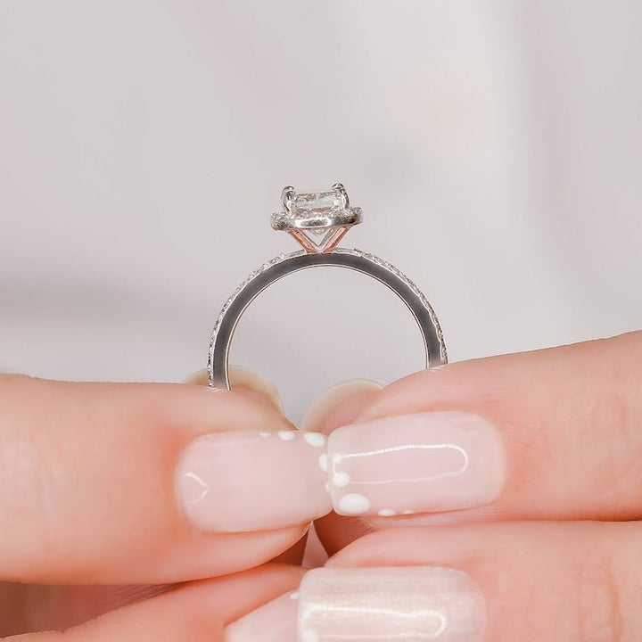 Detailed close-up of cushion halo diamond engagement ring