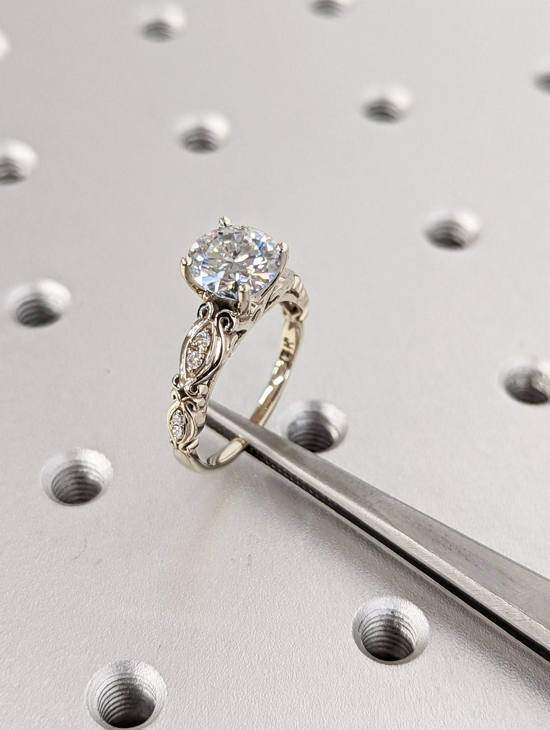 Side angle of round vintage diamond engagement ring