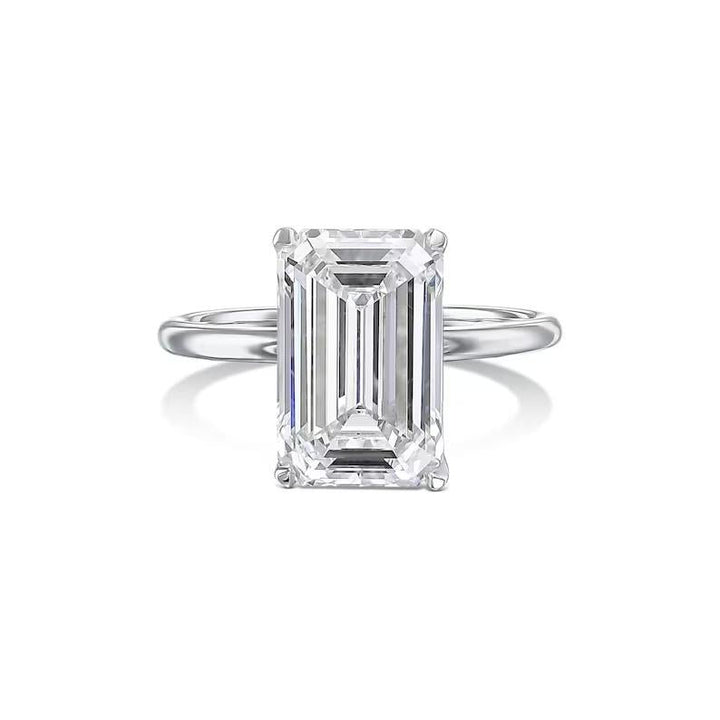 Emerald solitaire engagement ring photographed in natural light