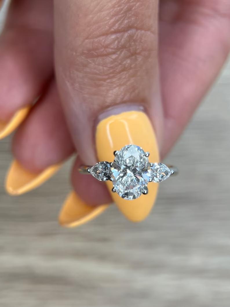 Discover oval three stone lab grown diamond engagement ring online
