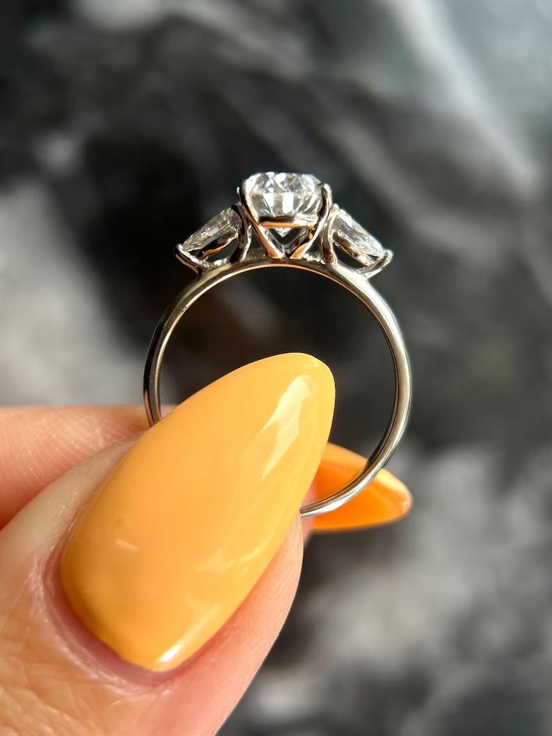 Buy oval cut three stone diamond engagement ring with free shipping