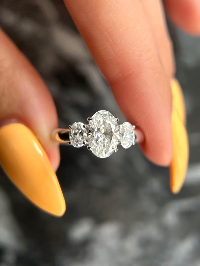1.50CT oval cut three stone engagement ring available to buy now
