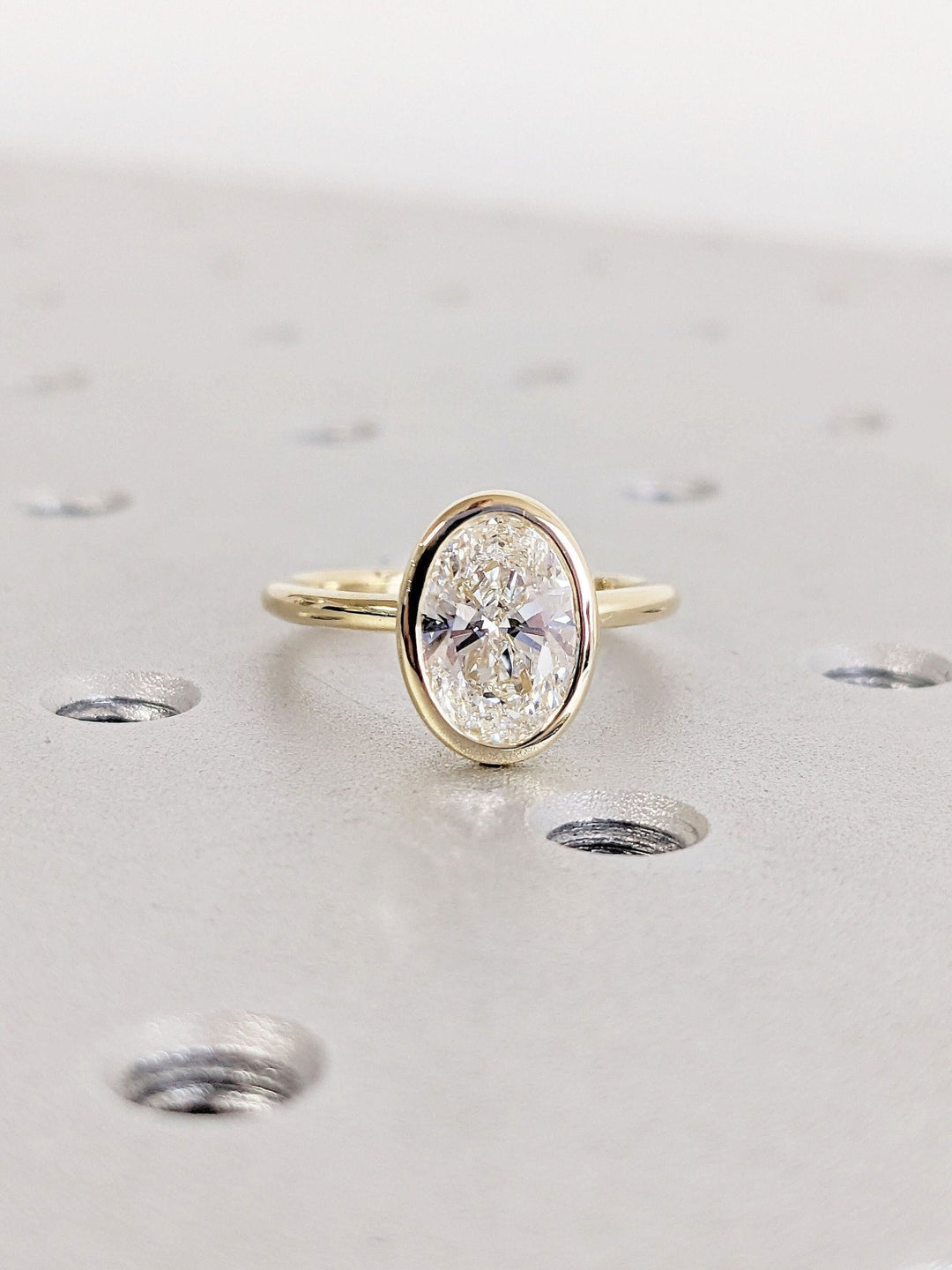 Discover oval bezel lab grown diamond engagement ring online