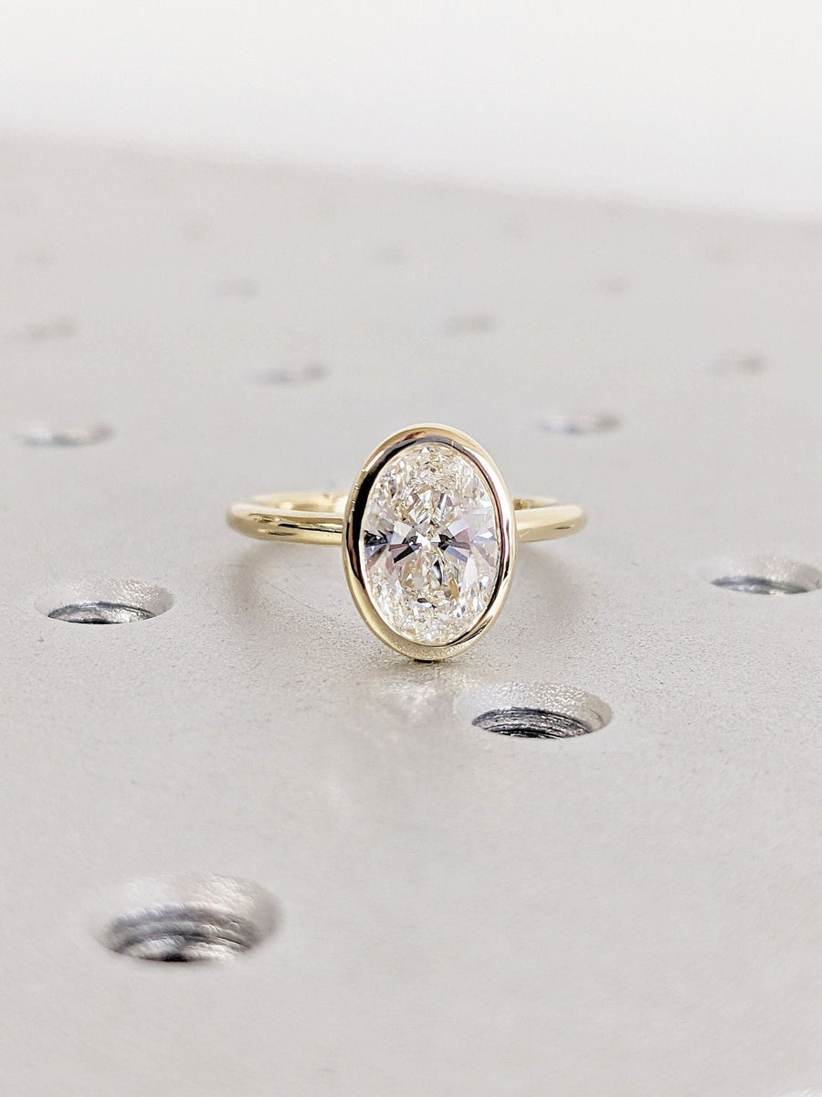 Discover oval bezel lab grown diamond engagement ring online