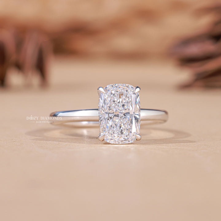 Cushion hidden halo engagement ring shown on hand for true-to-life sizing
