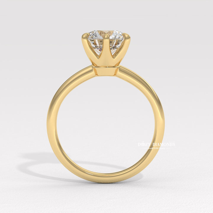 Detailed close-up of round solitaire diamond engagement ring