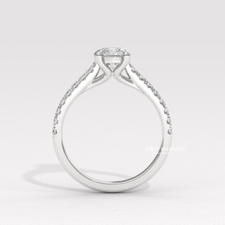 Round solitaire engagement ring photographed in natural light