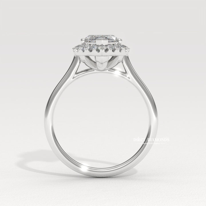 Marquise halo engagement ring shown on hand for true-to-life sizing