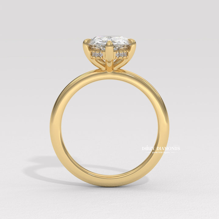 Pear hidden halo diamond ring presented in signature gift packaging