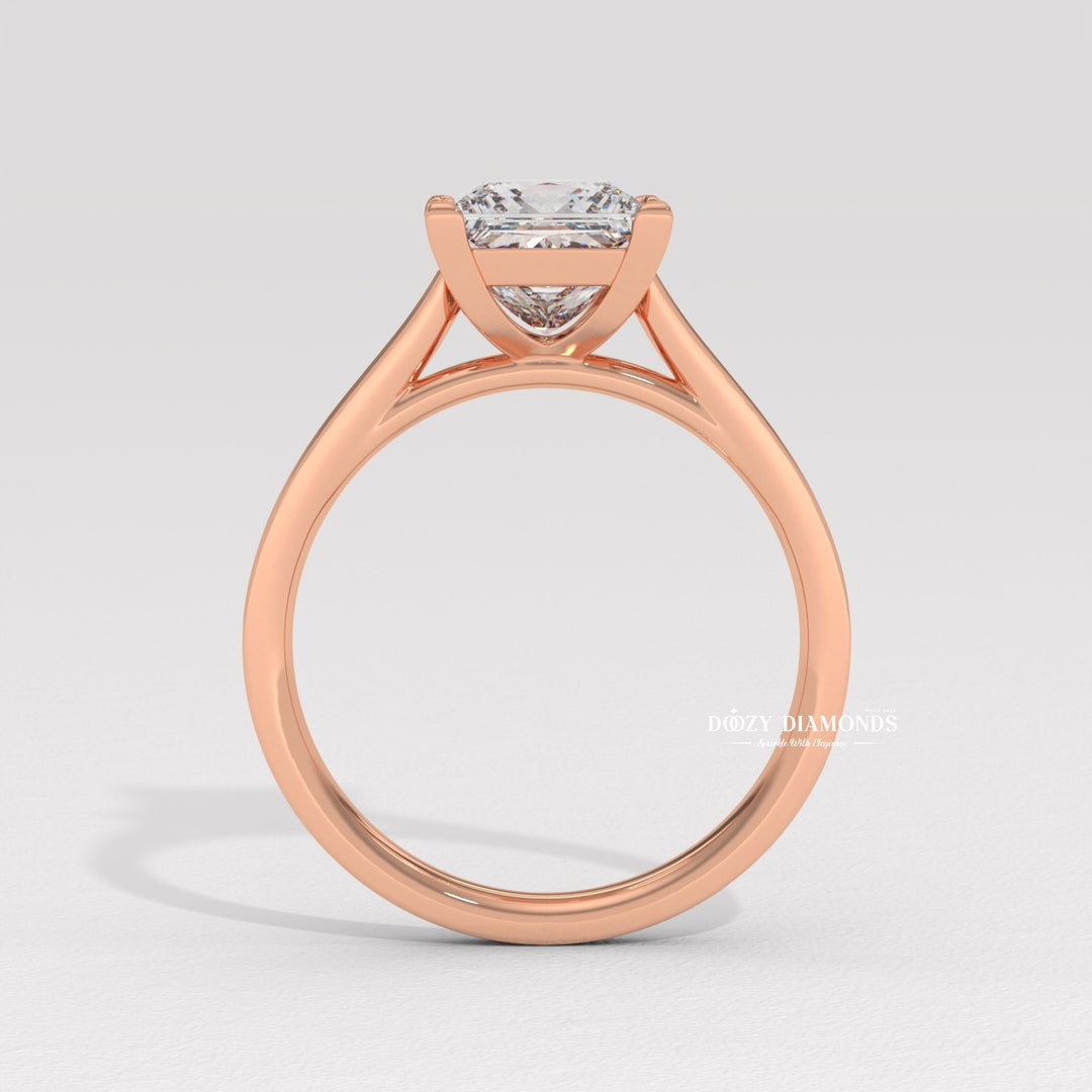 Close-up of princess cut center diamond in solitaire engagement ring