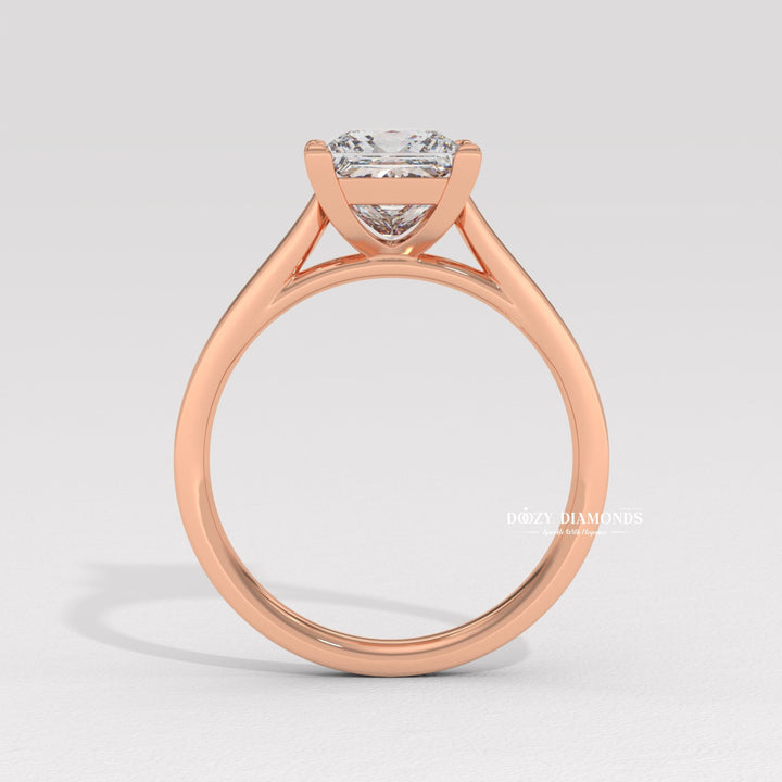 Close-up of princess cut center diamond in solitaire engagement ring