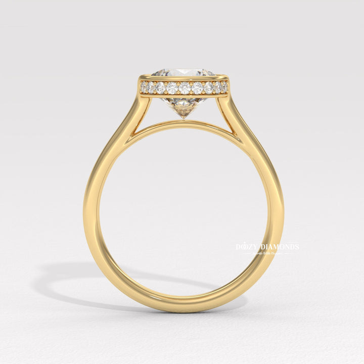 Round hidden halo engagement ring offered in gold and platinum