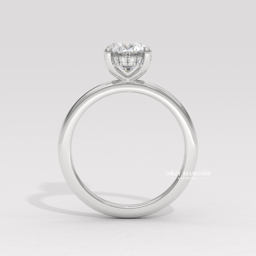Oval cut diamond ring worn on hand
