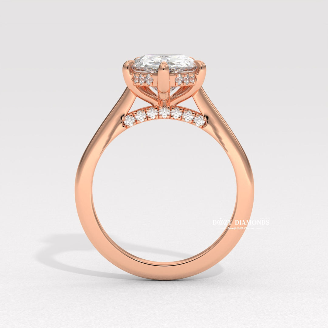 Pear solitaire diamond ring displayed on jewelry stand