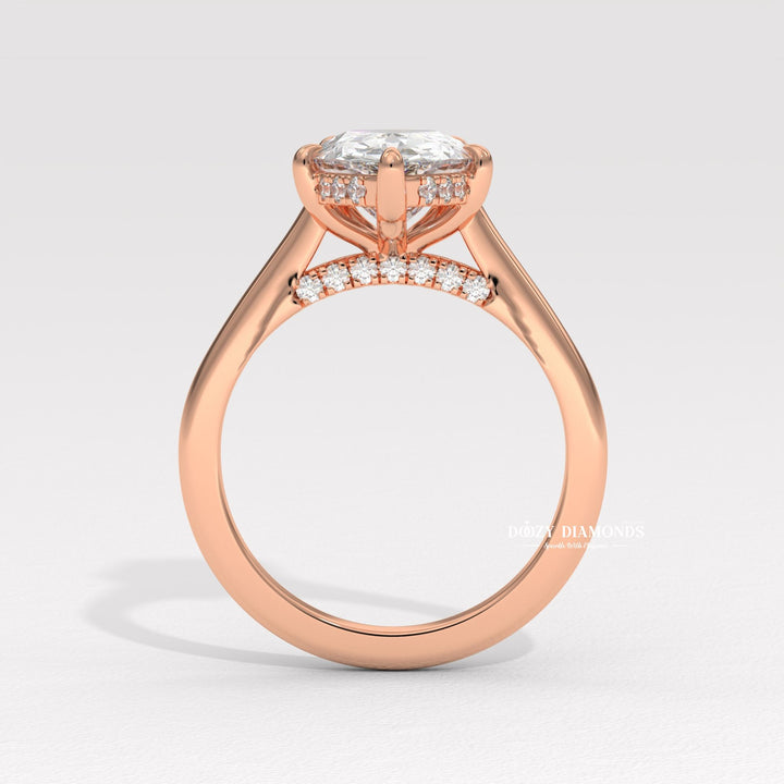 Pear solitaire diamond ring displayed on jewelry stand