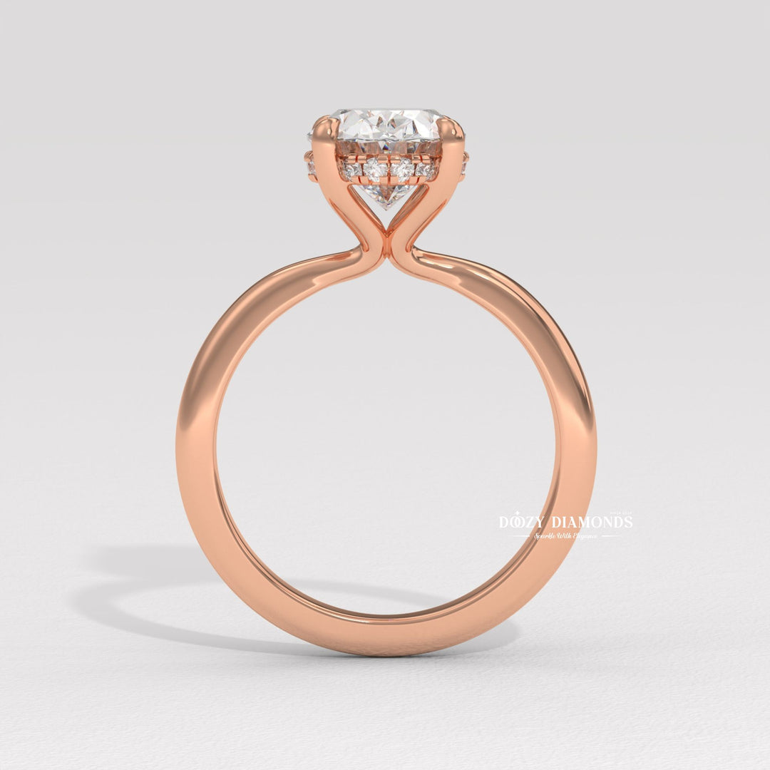 Oval cut diamond ring worn on hand