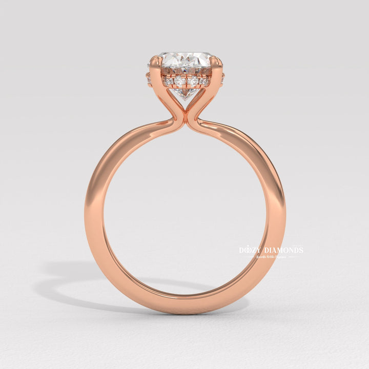 Oval cut diamond ring worn on hand