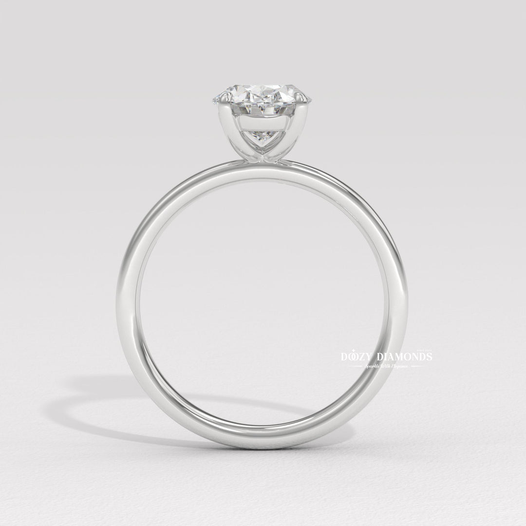 Oval cut diamond ring worn on hand