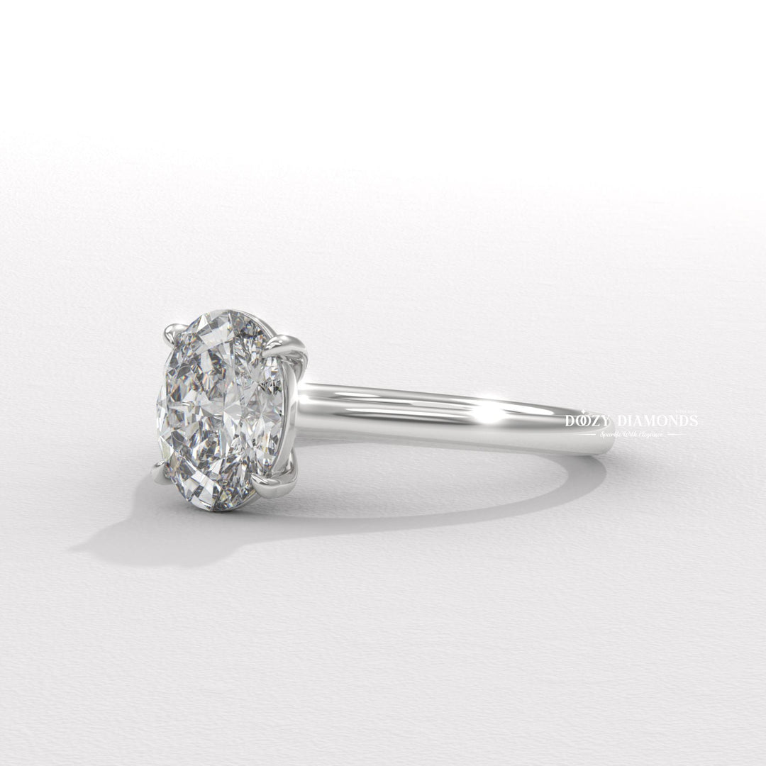Lifestyle shot of oval solitaire diamond ring on hand