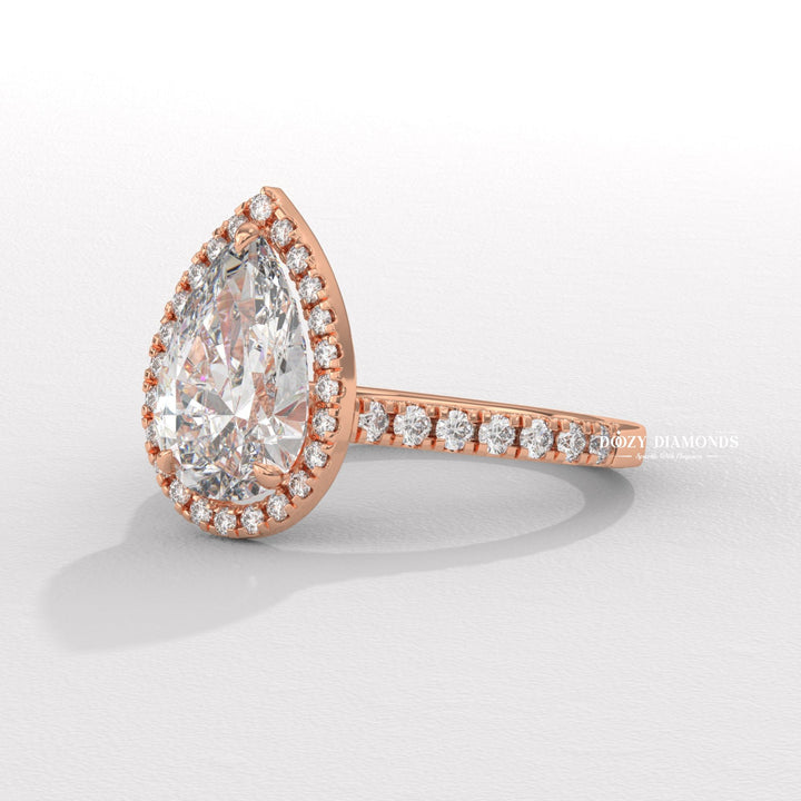 Pear halo lab grown diamond ring side profile in gold setting