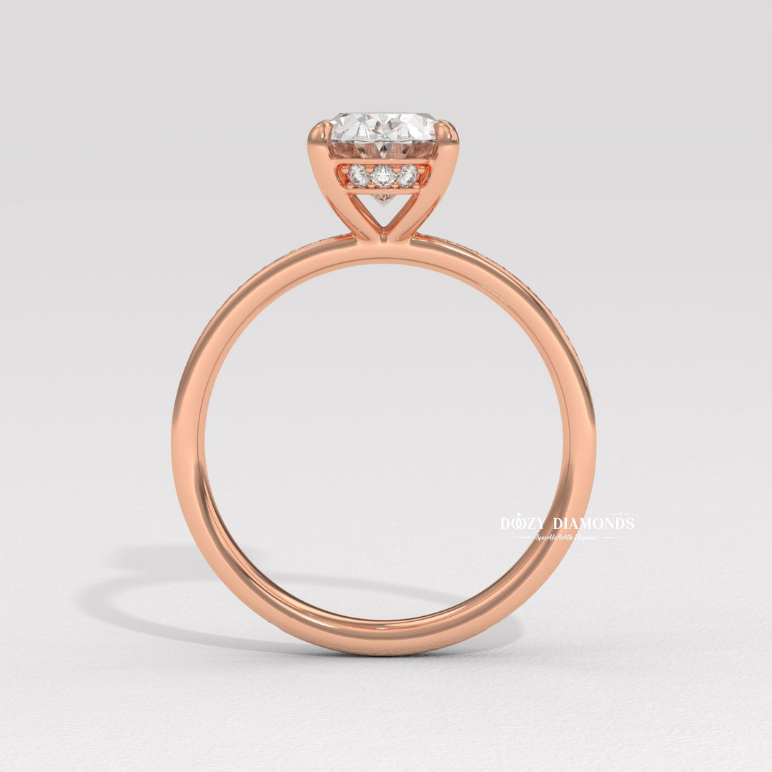 Oval solitaire engagement ring shown on hand for true-to-life sizing