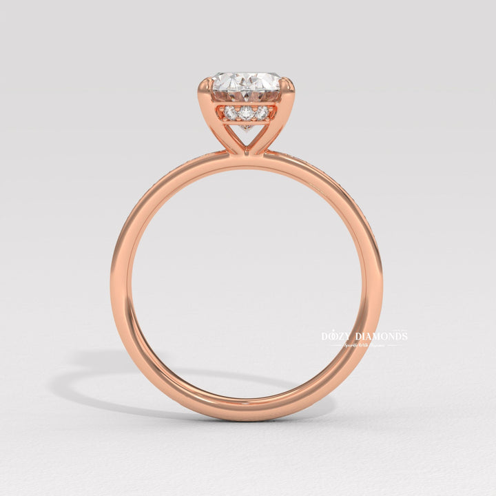 Oval solitaire engagement ring shown on hand for true-to-life sizing