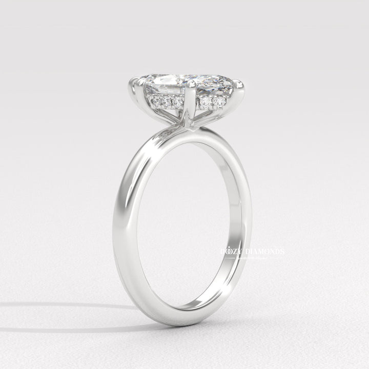 Marquise hidden halo ring set with an IGI graded diamond