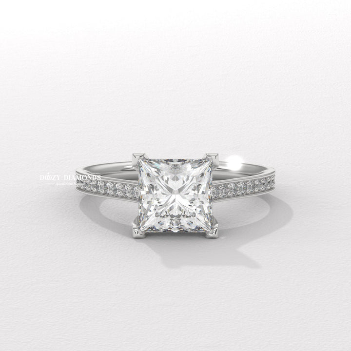 Detailed close-up of princess solitaire diamond engagement ring