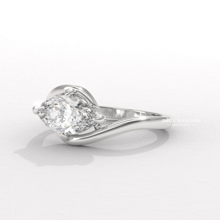 Macro shot of marquise cut diamond facets in east west ring setting