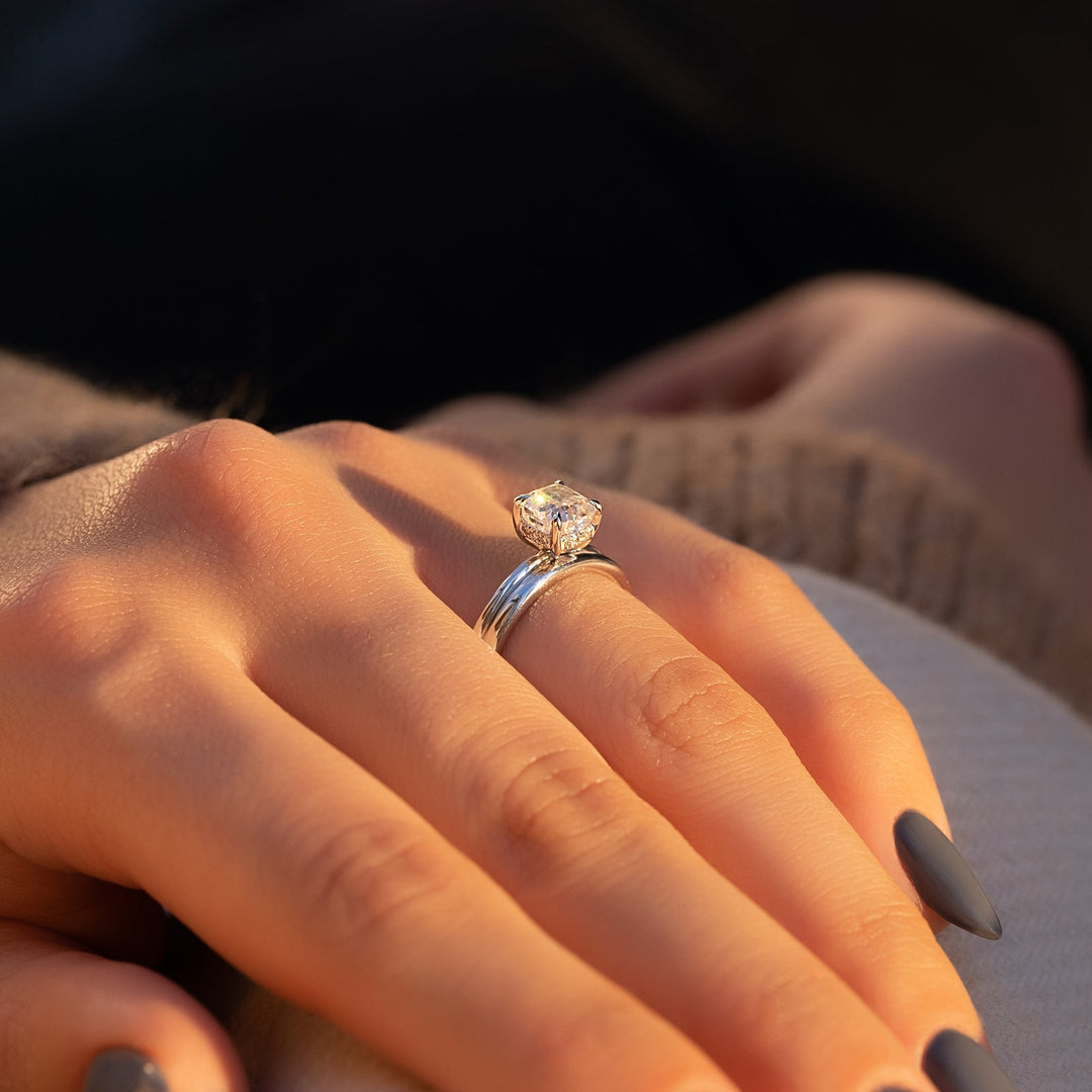 Cushion hidden halo engagement ring finished in polished solid gold