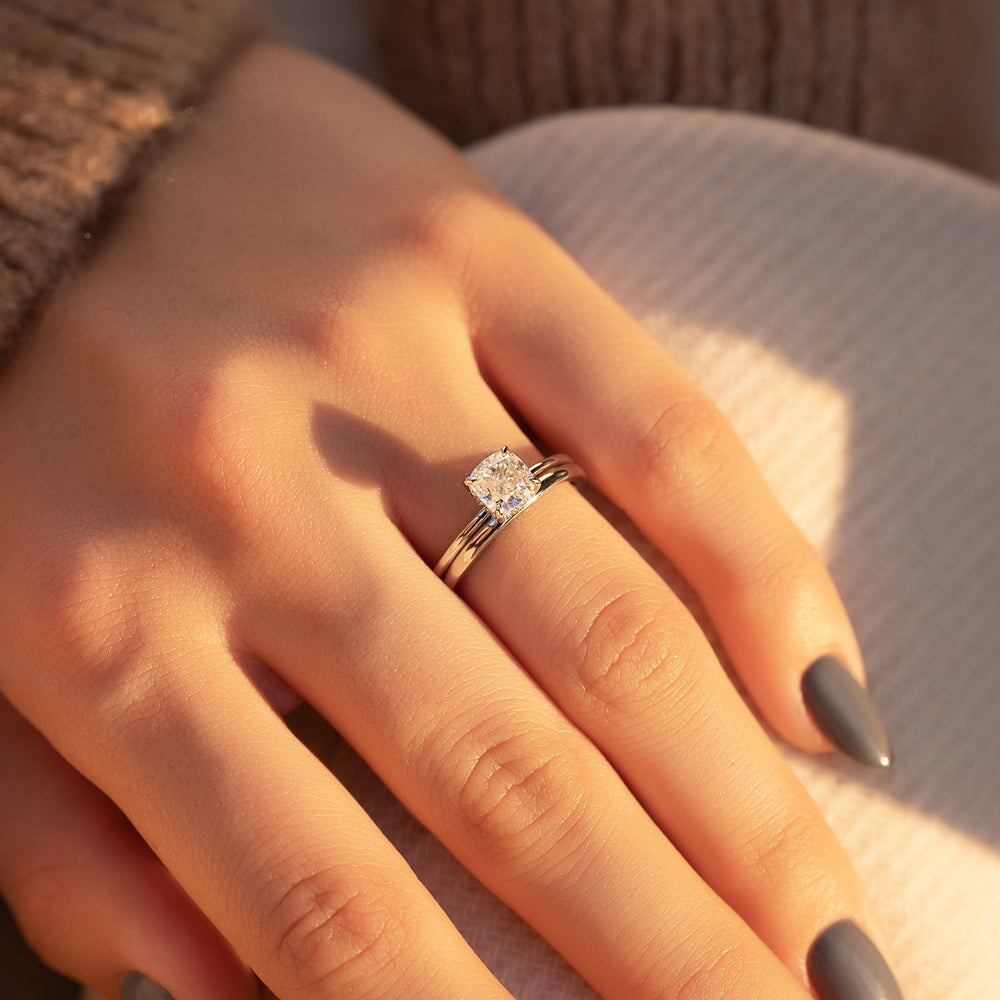 Fine craftsmanship detail on cushion hidden halo engagement ring