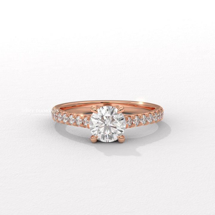 Round solitaire diamond ring displayed on jewelry stand