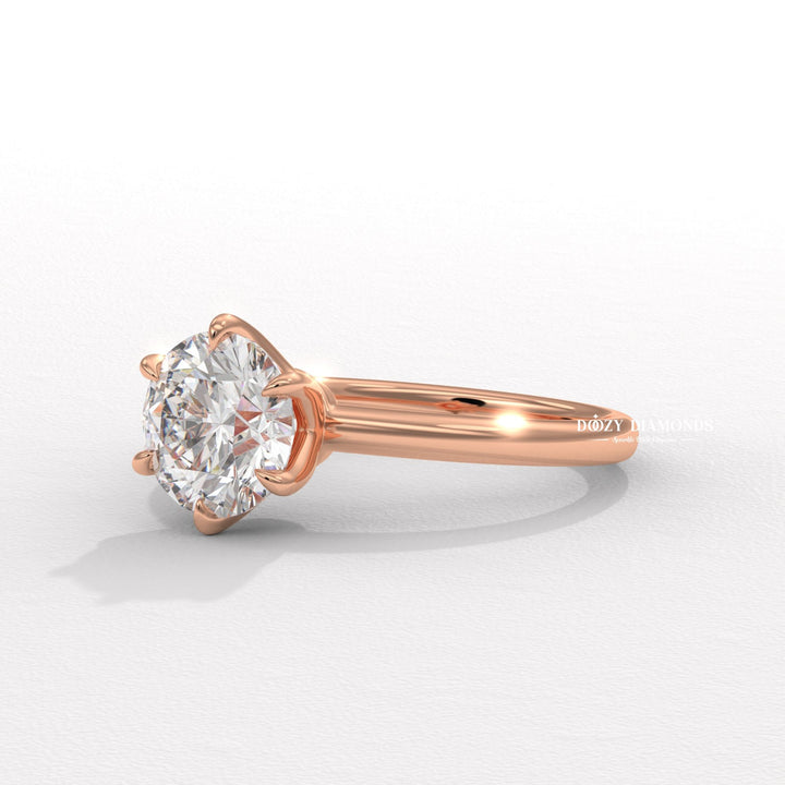 Profile view of round cut solitaire engagement ring band
