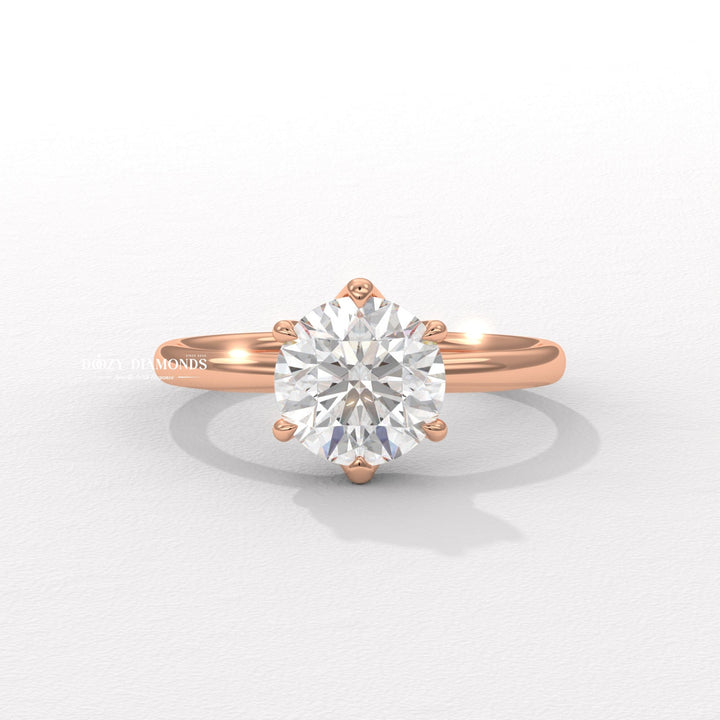 Fine craftsmanship detail on round solitaire engagement ring