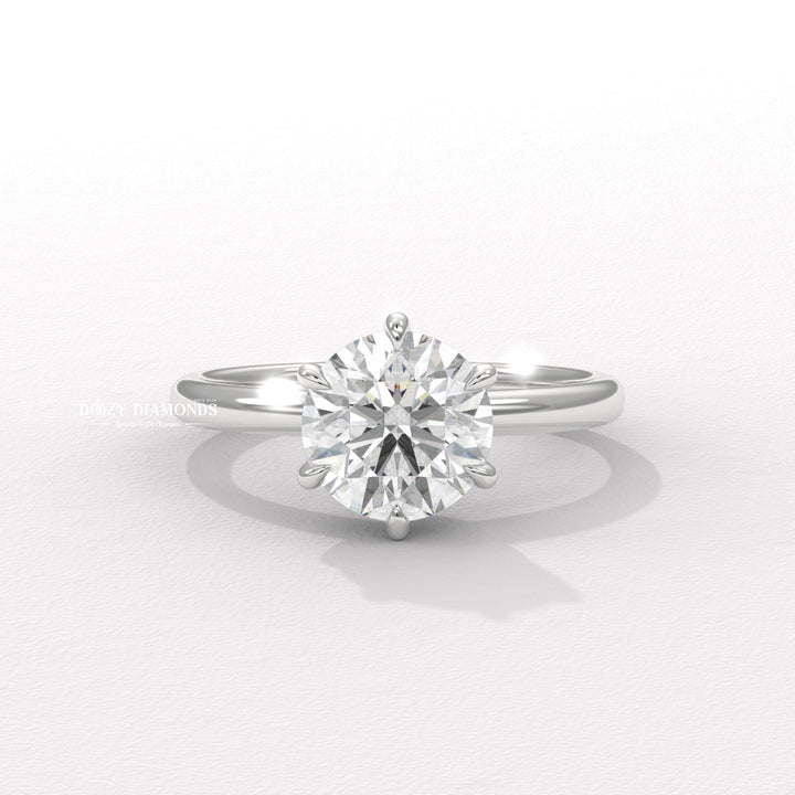 Round solitaire engagement ring viewed from the side