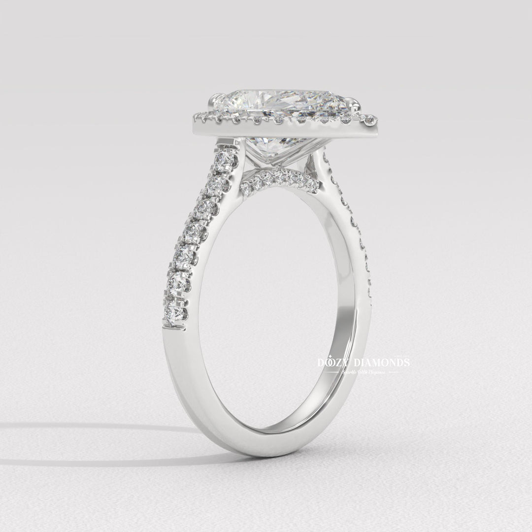 Side angle of pear halo diamond engagement ring