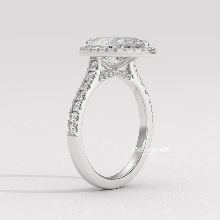 Side angle of pear halo diamond engagement ring