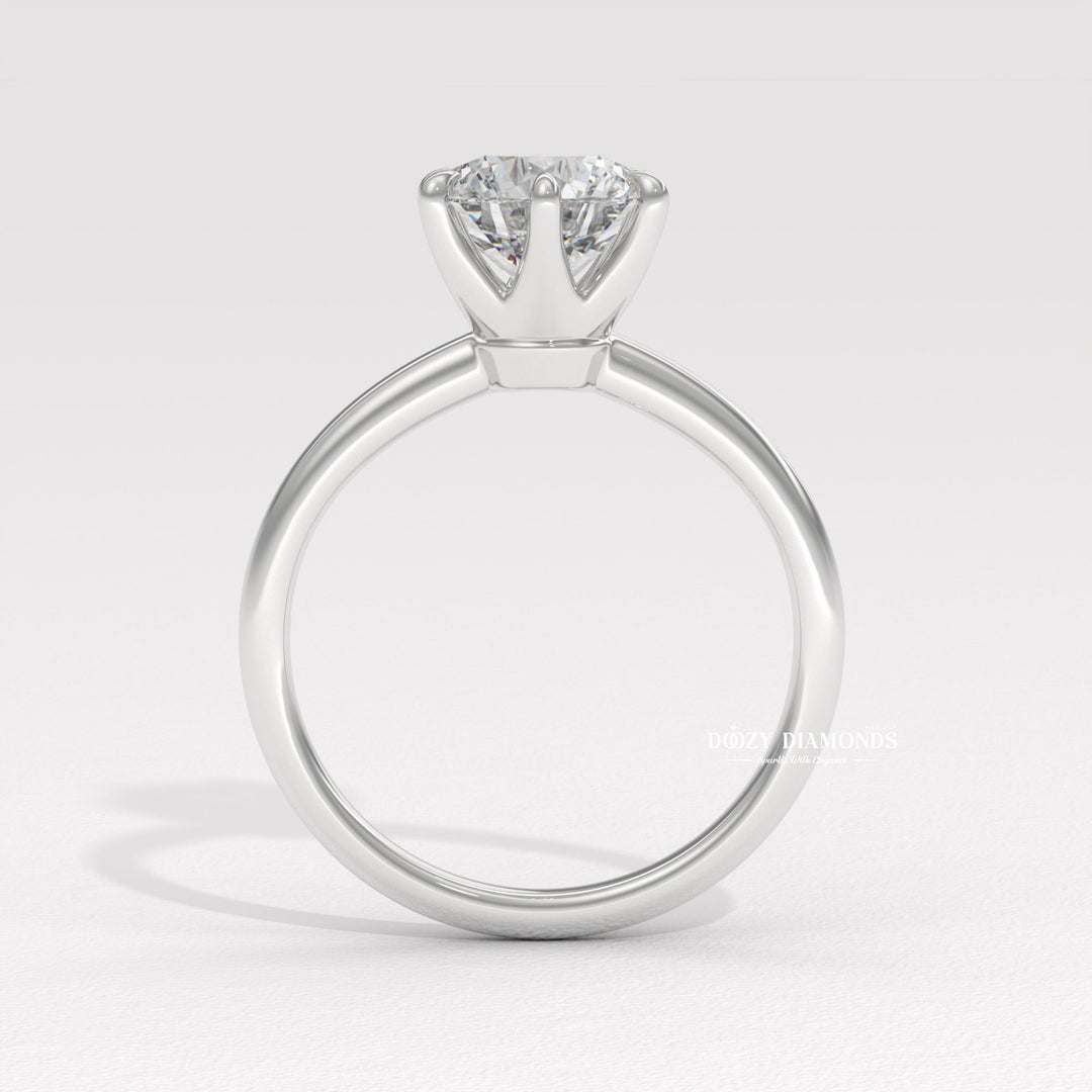 Round cut diamond ring worn on hand