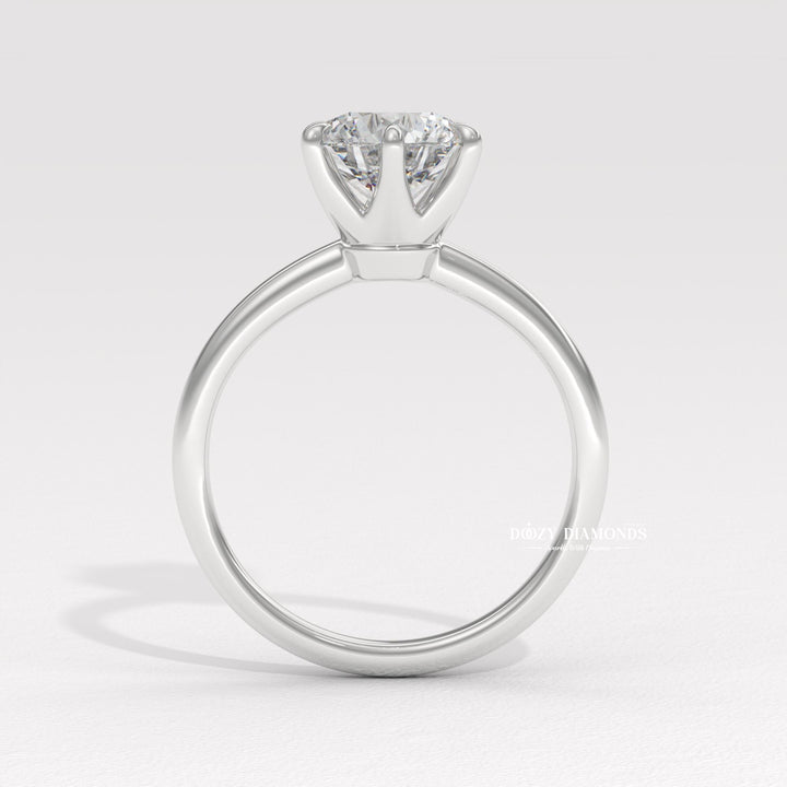 Round cut diamond ring worn on hand