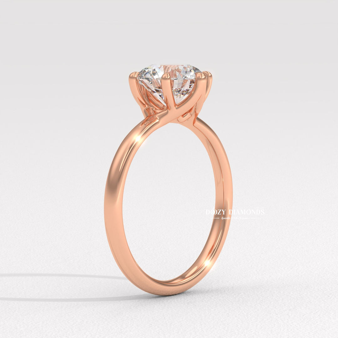 Round solitaire engagement ring finished in polished solid gold