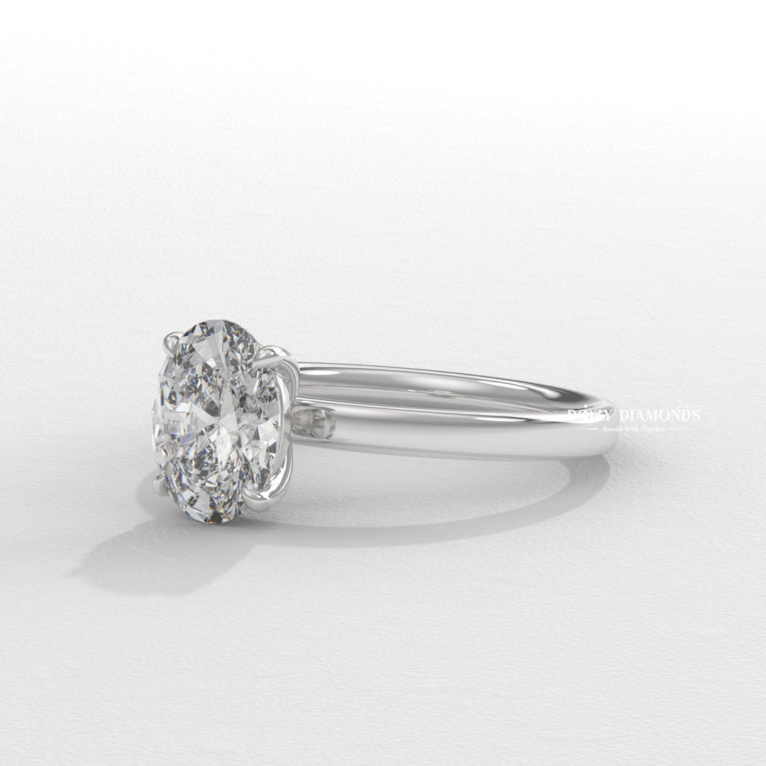 Oval solitaire lab grown diamond ring fitted on finger